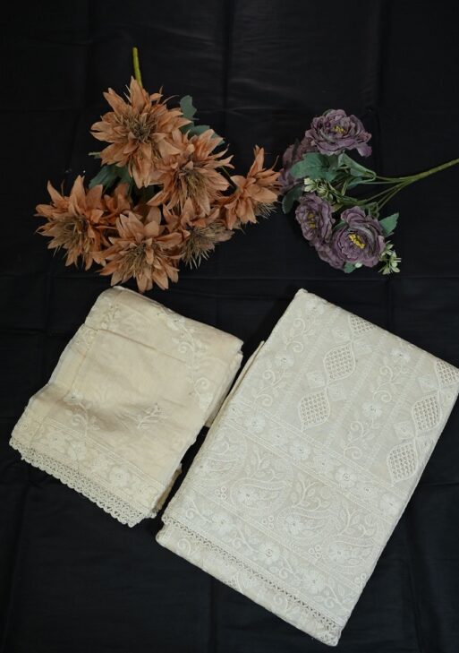 Beautiful beige suit with white work and plane bottom