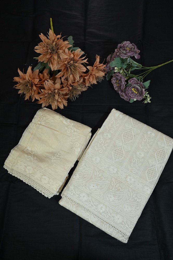 Beautiful beige suit with white work and plane bottom